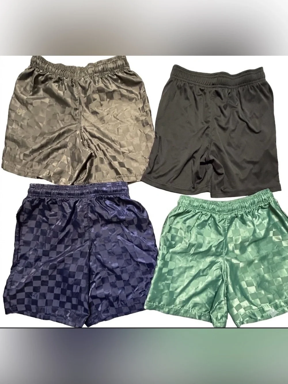BUNDLE of 4 Umbro boys' athletic  shorts with a embossed retro checkered pattern